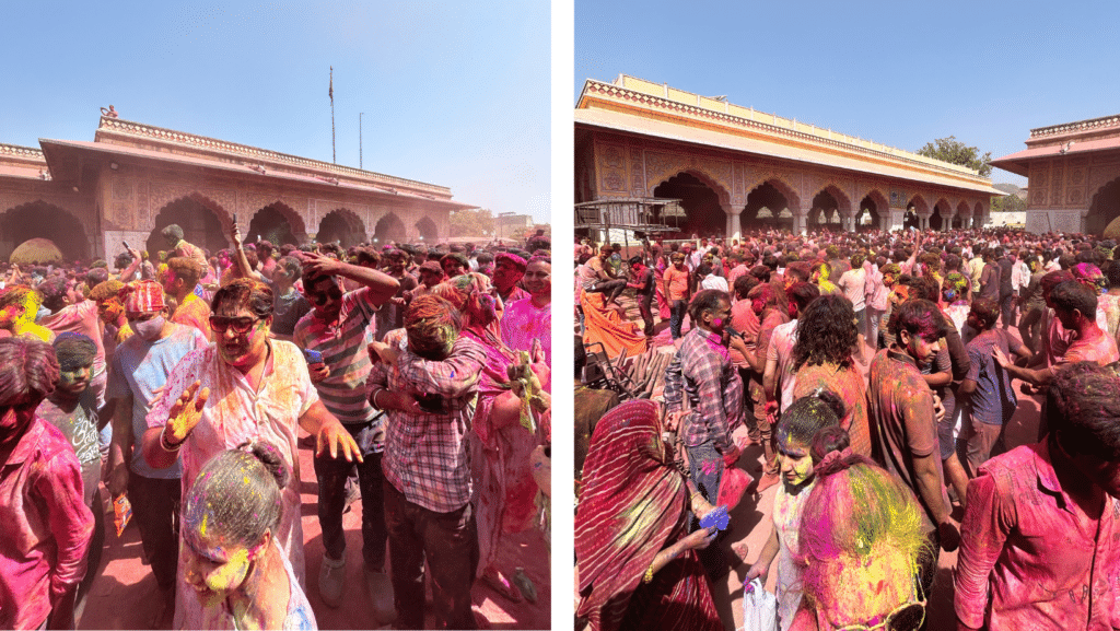 Crowds of people covered in a variety of coloured dust (pink, yellow, orange, red, blue) during vibrant Holi celebrations in India.